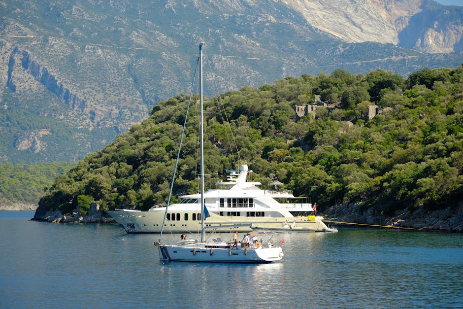 Sailing boats anchored in a picturesque Mediterranean bay surrounded by lush mountains